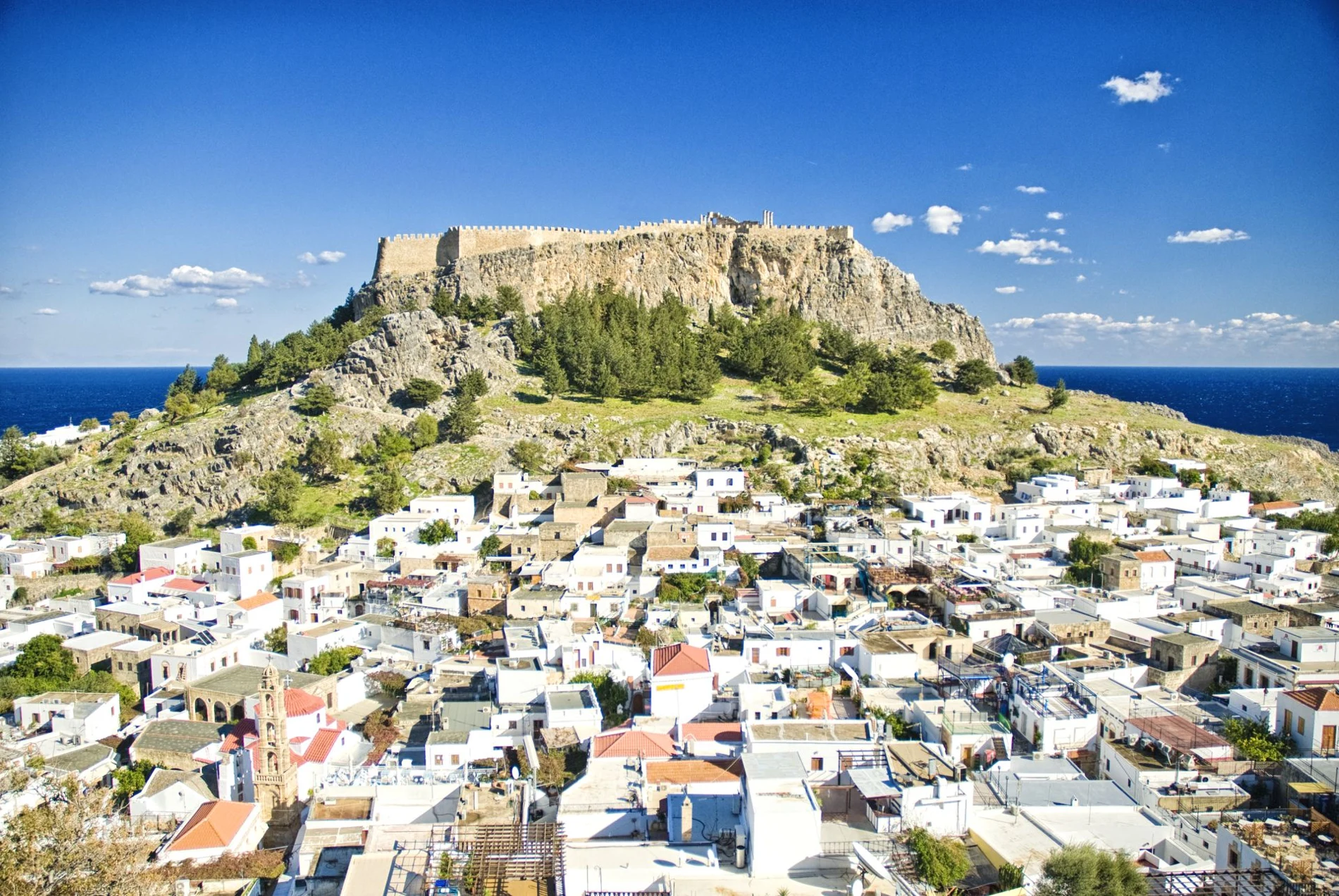 Whitewashed Lindos village beneath its ancient Acropolis