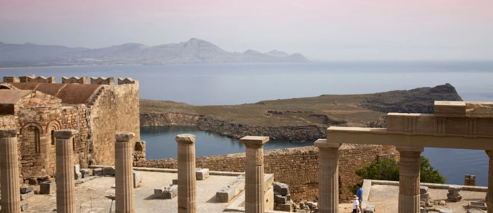 Ancient columns at Lindos Acropolis overlooking the sea
